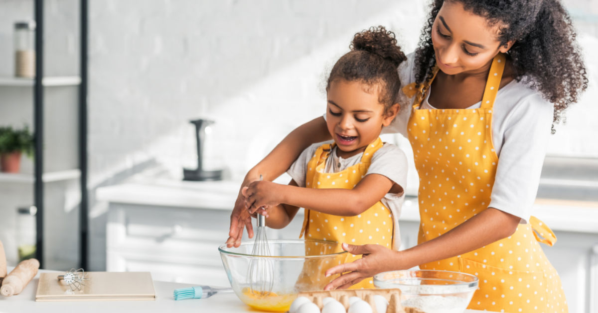 Mother and daughter in aprons